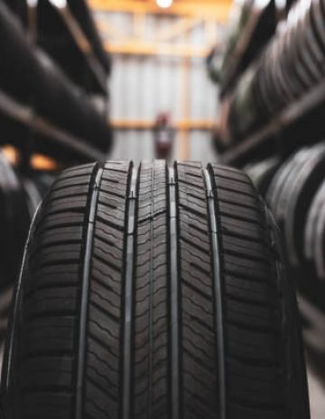 A new tire is placed on the tire storage rack in the car workshop. Be prepared for vehicles that need to change tires.